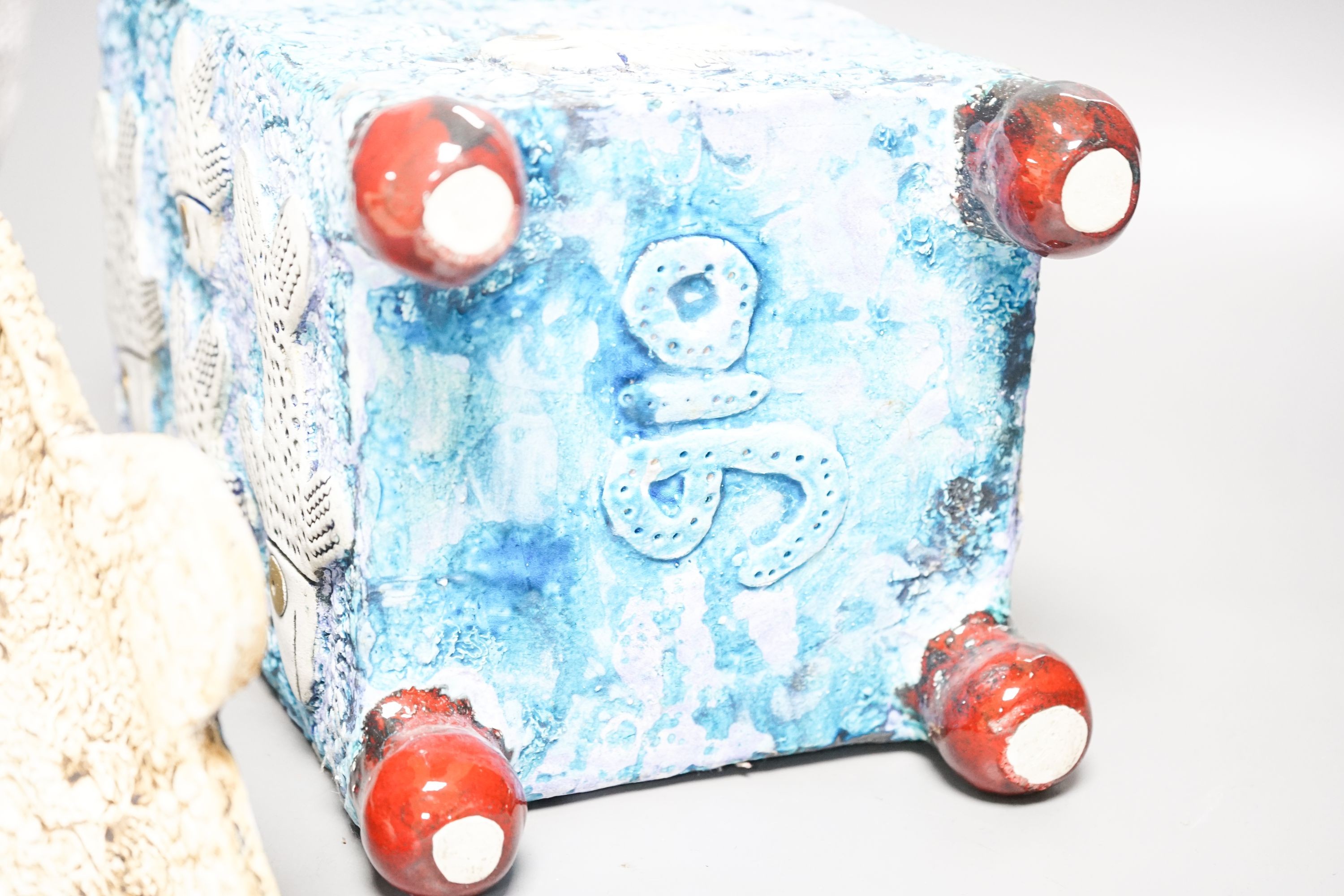 Gio Martin, a large square 'fish' jar and cover and a similar smaller jar and cover 44cm